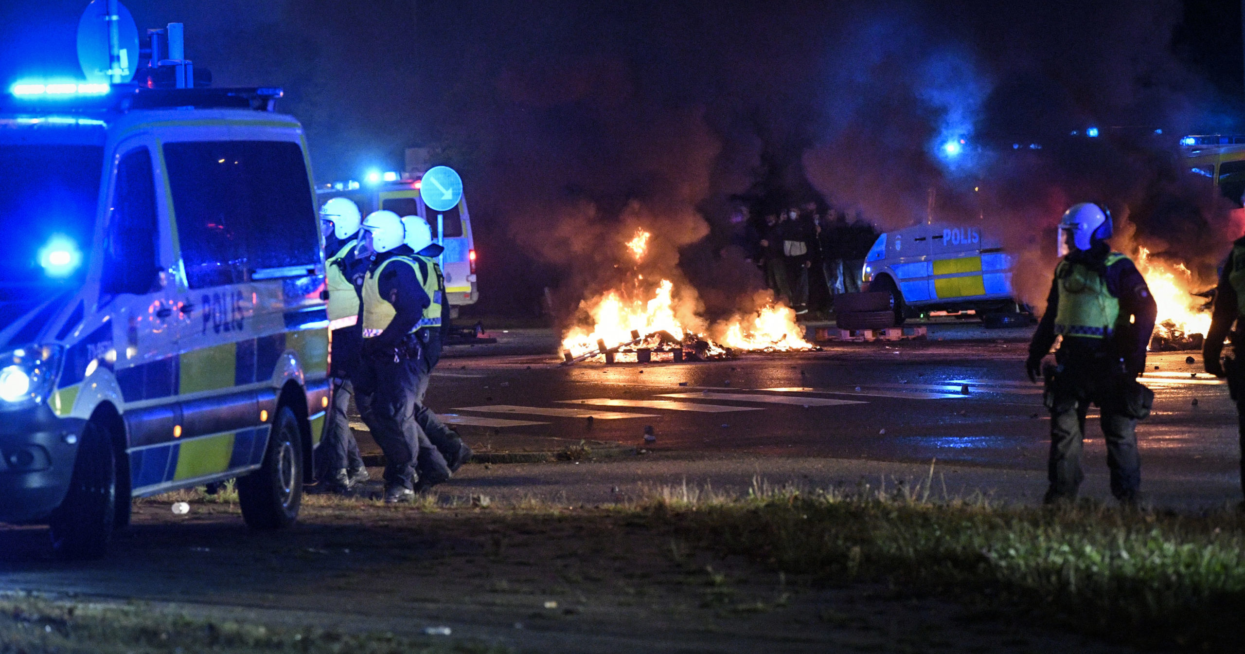 Police are seen as several hundred people riot in Sweden on Aug. 28, 2020. Activists burned a Quran in the southern Swedish city of Malmo, sparking riots and unrest after more than 300 people gathered to protest.