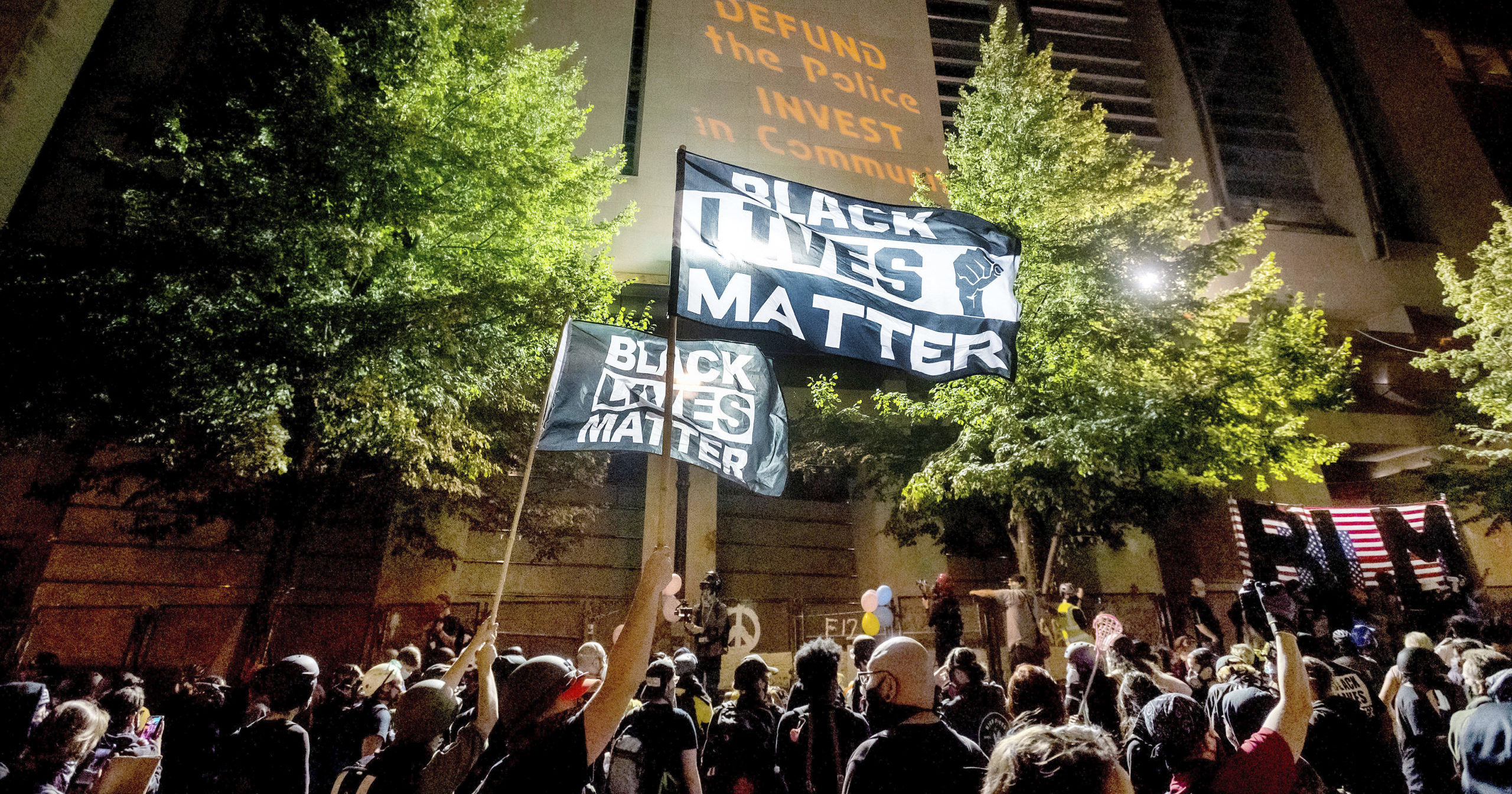 In this July 31, 2020, file photo, Black Lives Matter protesters gather at the Mark O. Hatfield United States Courthouse in Portland, Oregon. At least two federal buildings in Portland have been closed and the FBI is investigating after a threat of violence was reported, officials said on Aug. 21, 2020.
