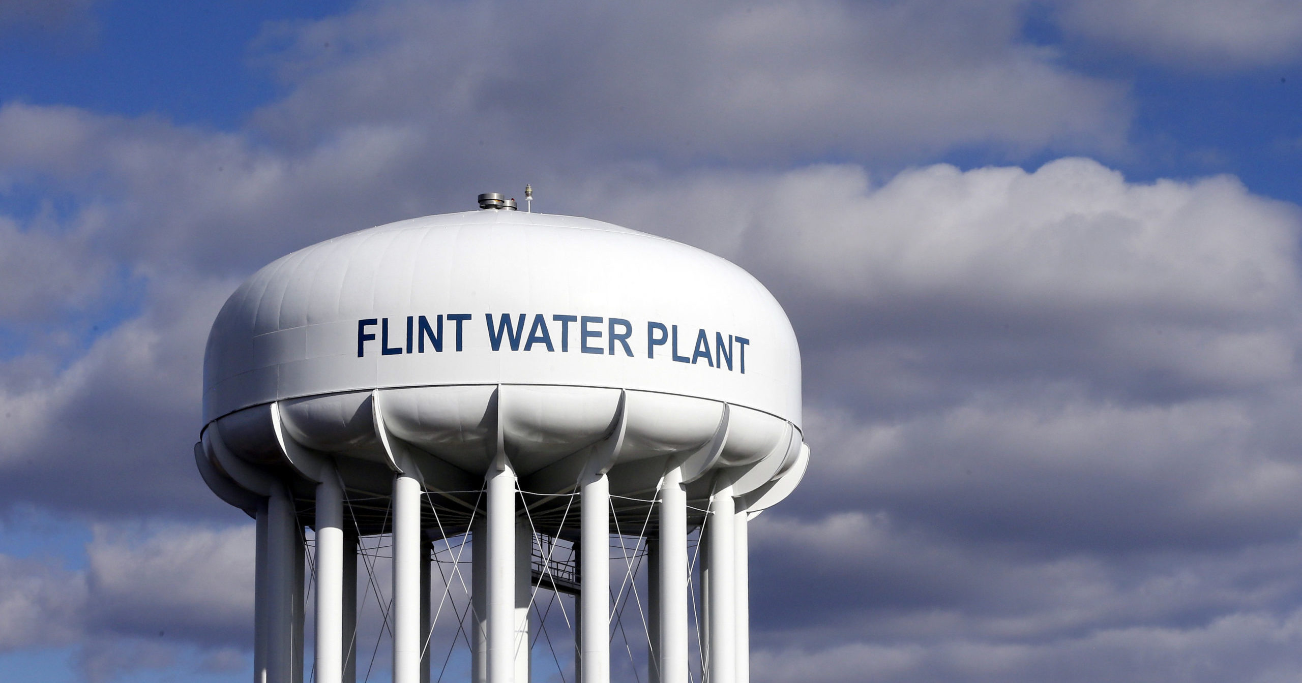 In this March 21, 2016, file photo, the Flint Water Plant water tower is seen in Flint, Michigan. Multiple news outlets reported on Aug. 19, 2020, that the state of Michigan has reached a $600 million agreement to compensate Flint residents whose health was damaged by lead-tainted drinking water.