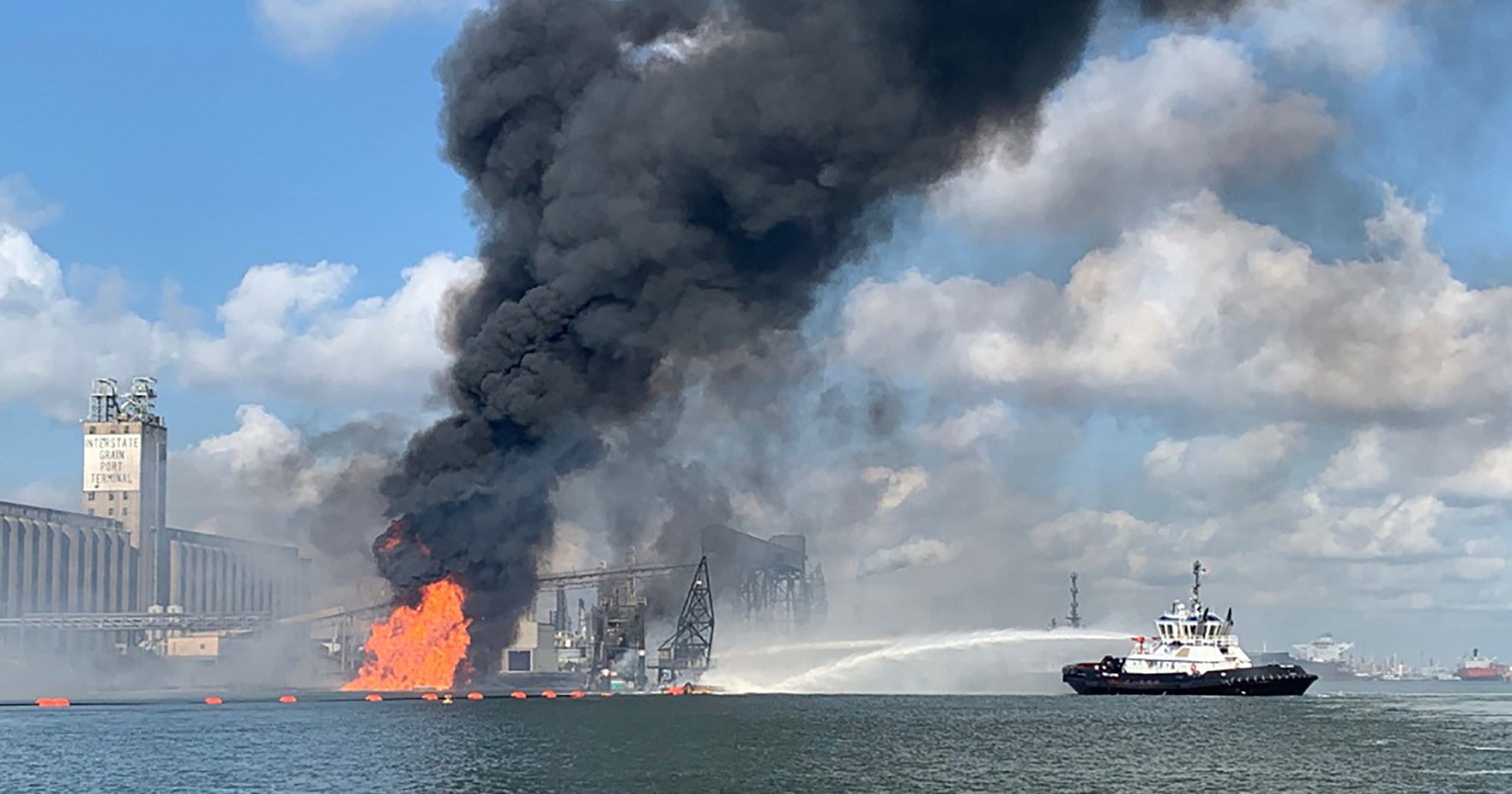 In this photo released by the U.S. Coast Guard, Coast Guard crews respond to a fire in the Port of Corpus Christi on Aug. 21, 2020, in Corpus Christi, Texas.