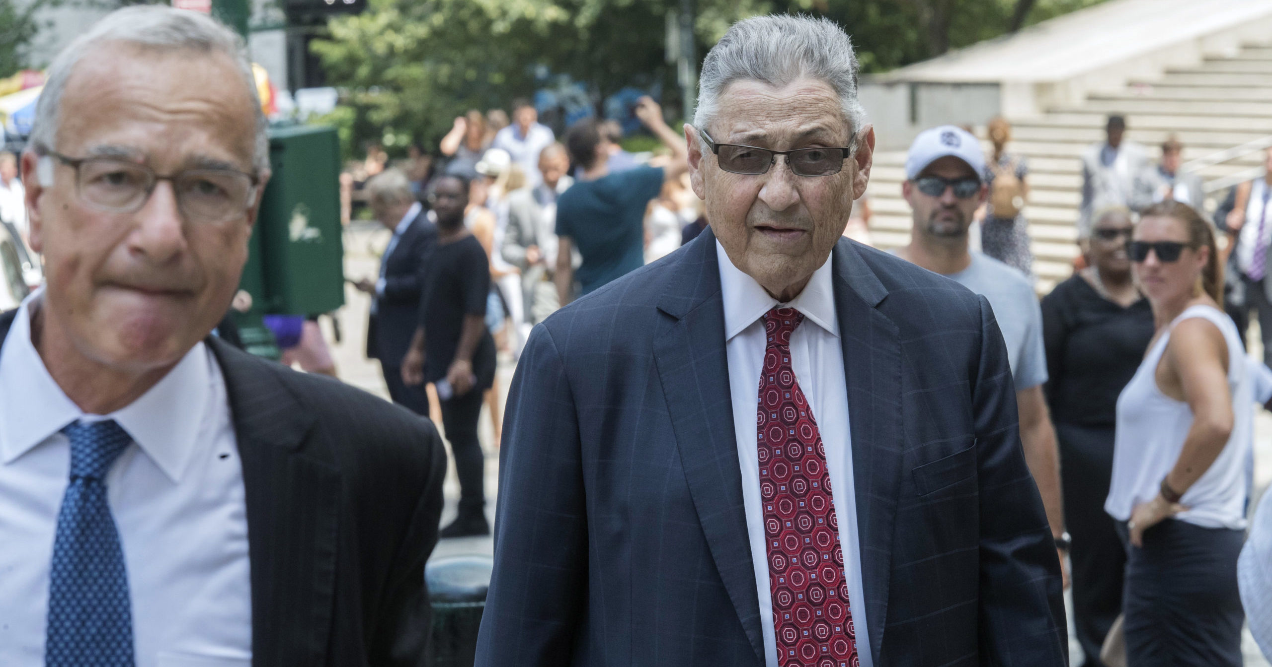 In this July 27, 2018, file photo, former New York Assembly Speaker Sheldon Silver, right, arrives at federal court in New York. Silver has been sentenced to 6 1/2 years in prison on corruption charges.