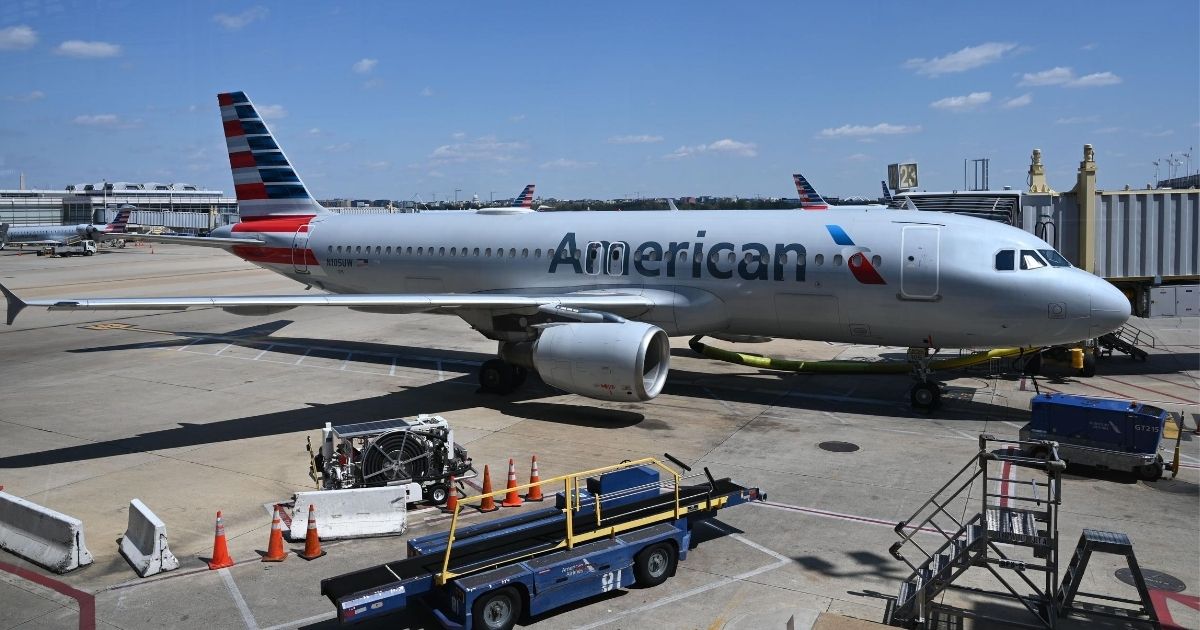 An American Airlines airplane is seen at gate at Washington National Airport on April 11, 2020, in Arlington, Virginia.