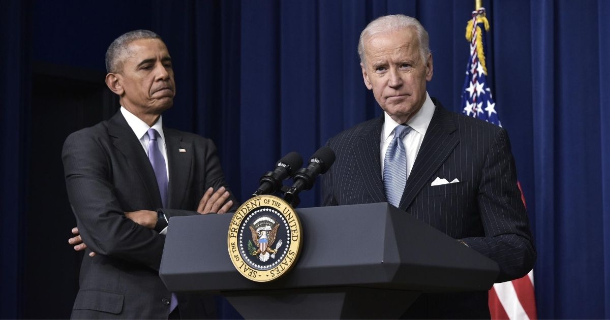 Then-Vice President Joe Biden, right, speaks, while then-President Barack Obama listens in the South Court Auditorium next to the White House on Dec. 13, 2016, in Washington, D.C.