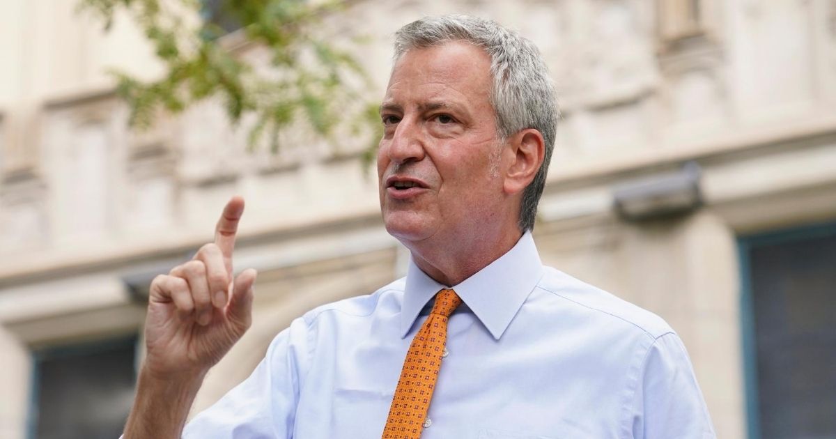 New York City Mayor Bill de Blasio speaks to reporters after visiting New Bridges Elementary School to observe pandemic-related safety procedures on Aug. 19, 2020, in the Brooklyn borough of New York.