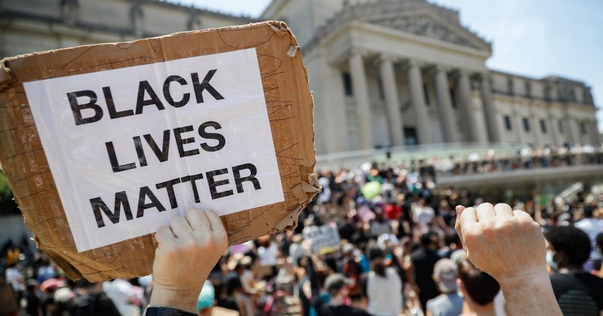 A protester holds a sign that reads "BLACK LIVES MATTER" during a Juneteenth rally outside the Brooklyn Museum on June 19, 2020, in the Brooklyn borough of New York.