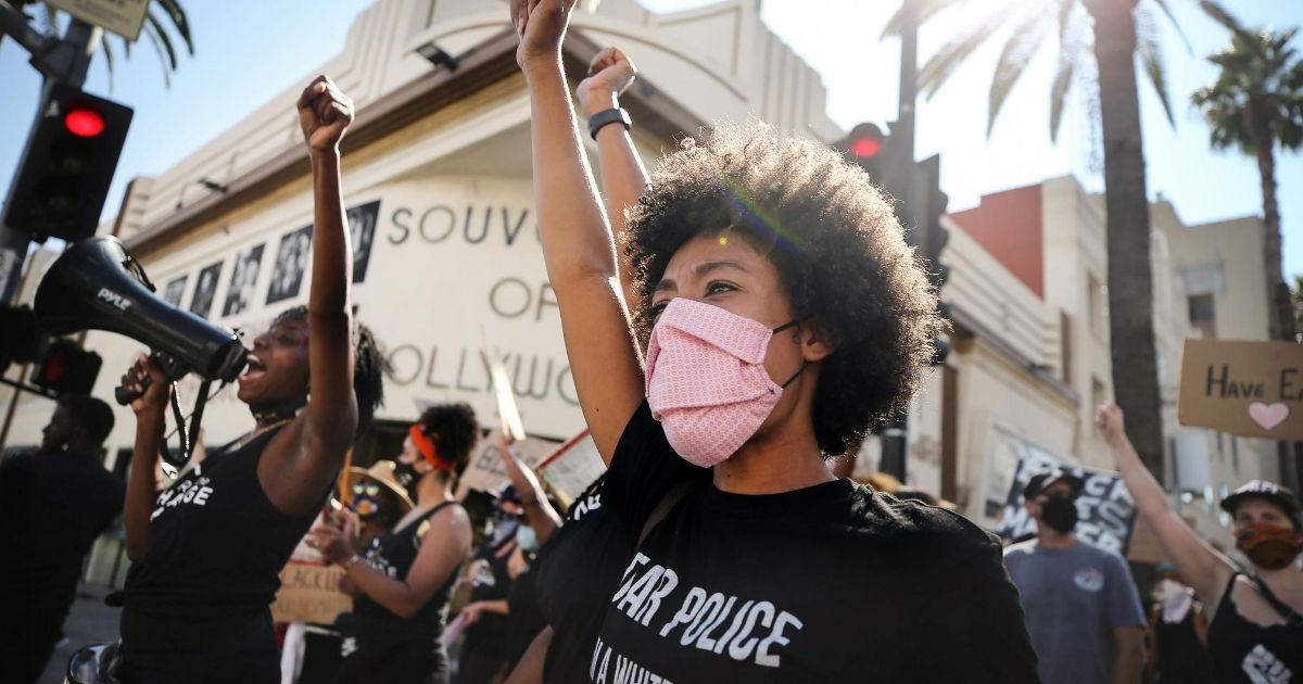 Black Lives Matter protesters march in a protest in Los Angeles on August 28, 2020.