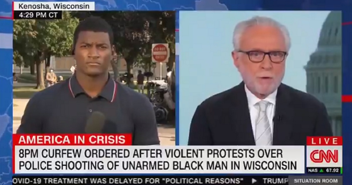 A chyron appearing on the bottom of the screen of "The Situation Room Wolf Blitzer" on Monday describes protests in Kenosha, Wisconsin, as "violent."