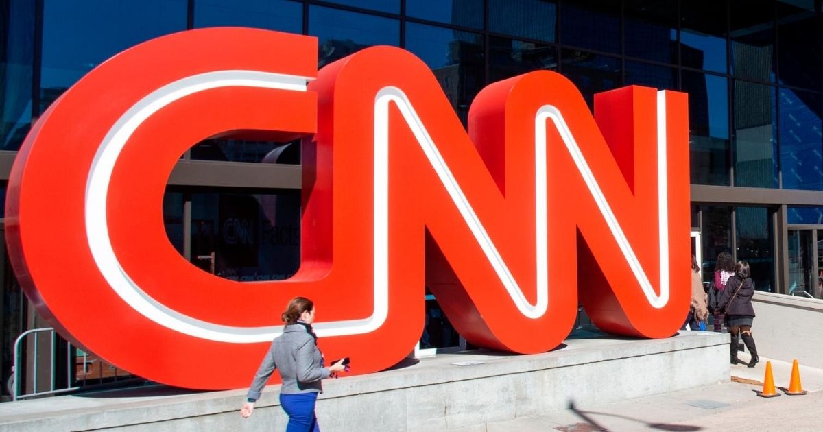 People walk outside CNN Center on Oct. 24, 2018, in Atlanta.