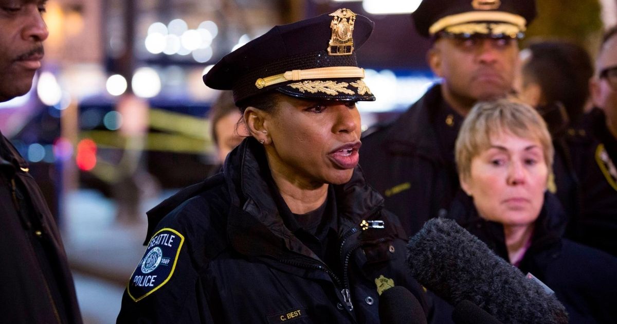Seattle Police Chief Carmen Best, center, speaks to reporters at the scene of a shooting that left one person dead and seven injured, including a child, in downtown Seattle, Washington, on Jan. 22, 2020.