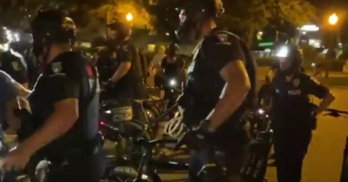 There was a scuffle with counter-protesters before demonstrators turned their anger on the police in Charlotte, North Carolina, on Monday.