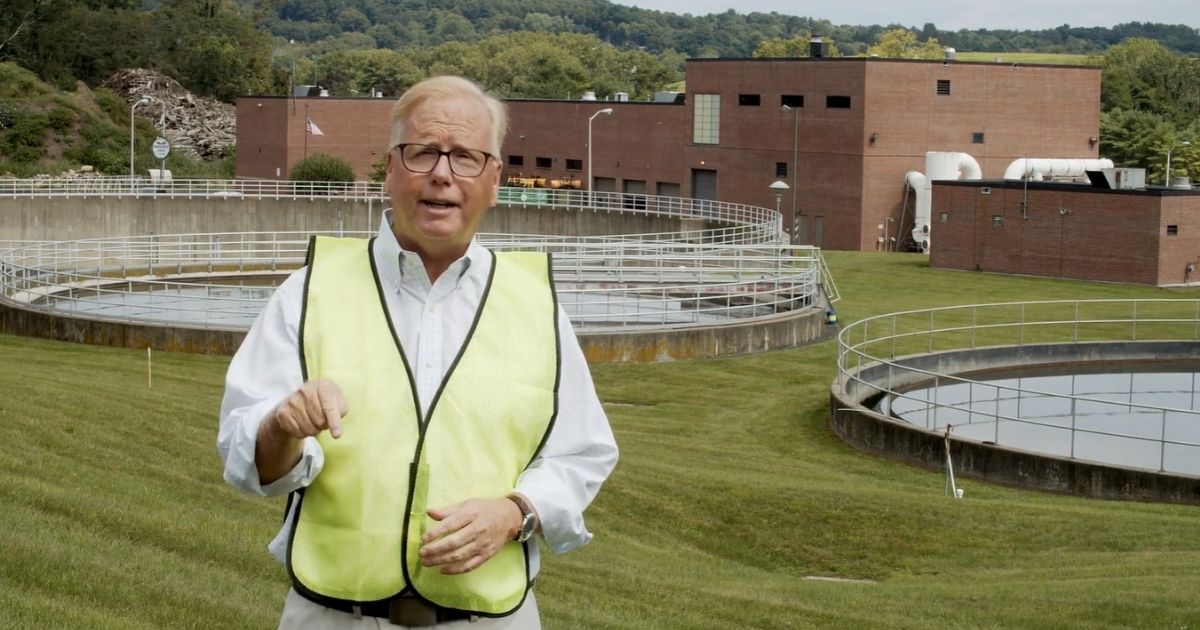 Mayor Mark Boughton of Danbury, Connecticut, reveals the new name of the city's sewage plant.