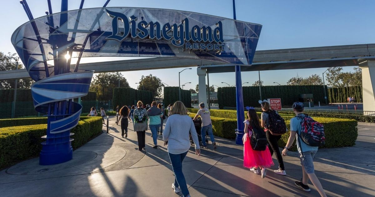 Visitors enter the Disneyland Resort in Anaheim, California, on Feb. 25, 2020.