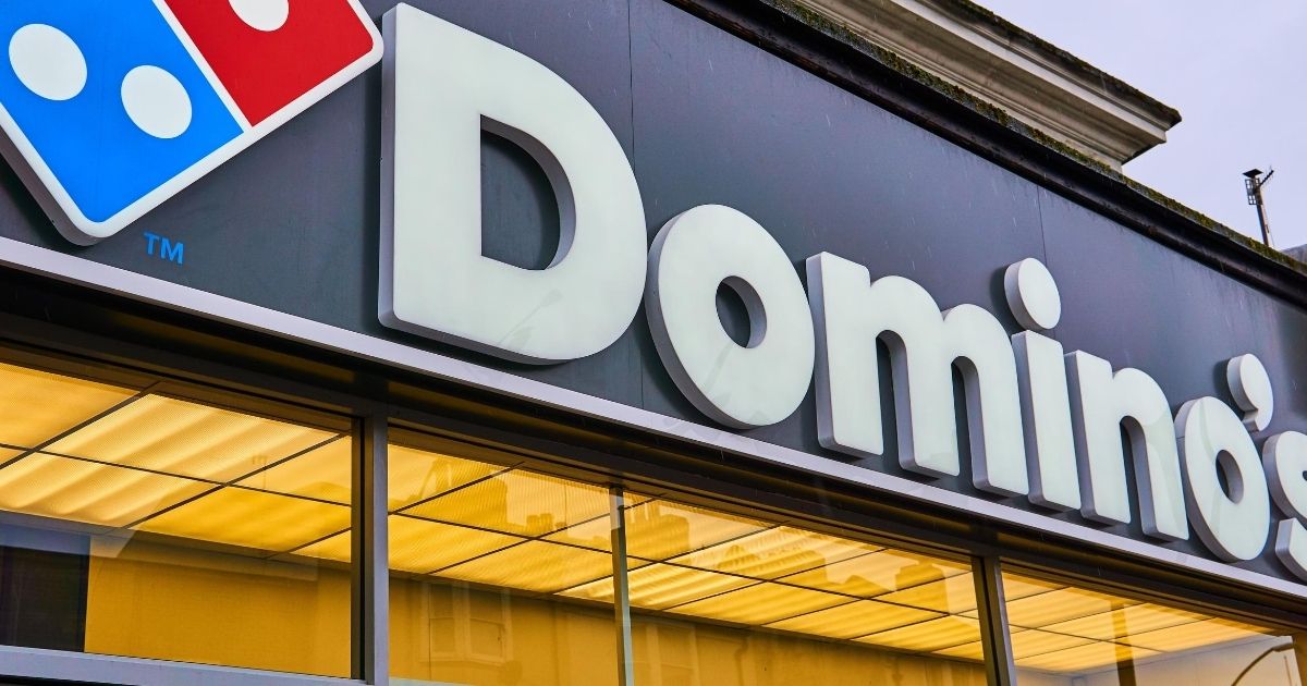 A Domino's pizza sign is seen over a store in the stock image above. Recently, a Domino's employee reportedly responded to a customer's request for a joke with a sweet substitution.