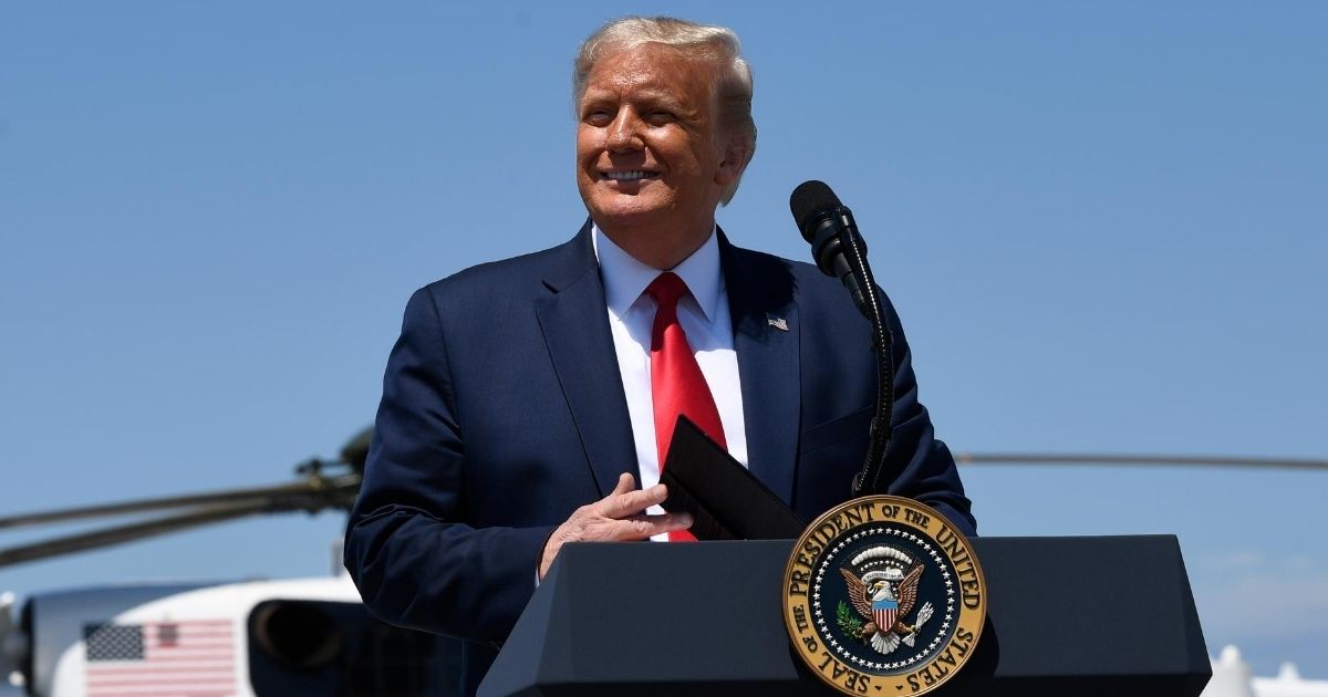 President Donald Trump smiles during remarks at the Burke Lakefront Airport in Cleveland, Ohio, on Aug. 6, 2020.