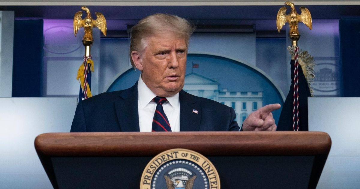 President Donald Trump points to reporter to ask a question as he speaks during a media briefing in the James Brady Briefing Room of the White House on Aug. 23, 2020, in Washington.