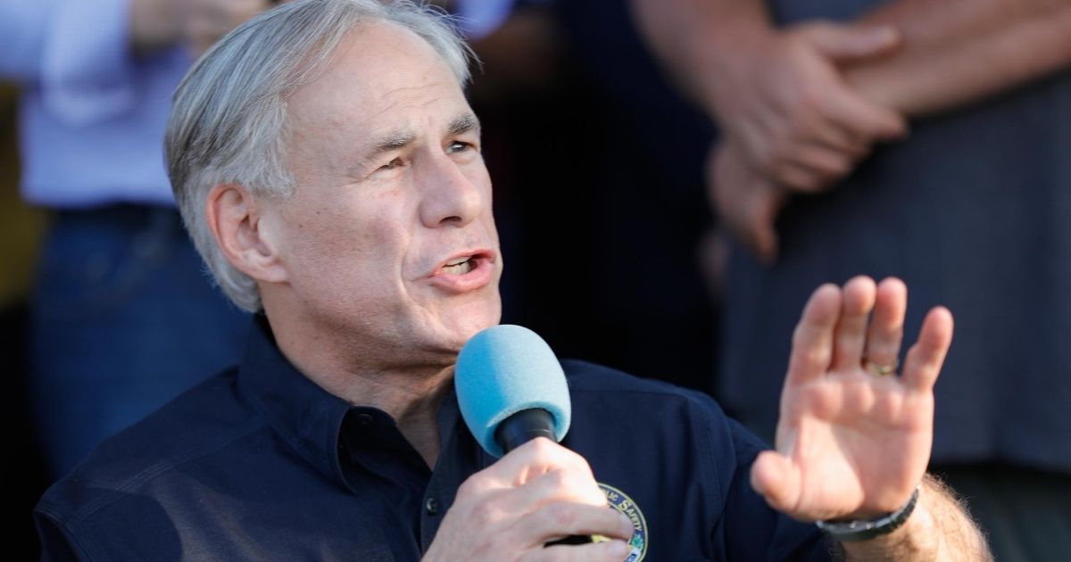 Texas Gov. Greg Abbott speaks to family and friends at a vigil held at the First Bank in Santa Fe for the victims of a shooting at Santa Fe High School on May 18, 2018.