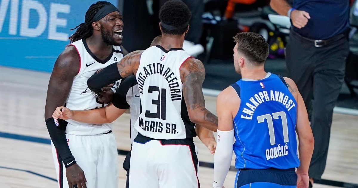Montrezl Harrell of the Los Angeles Clippers shouts at Dallas Mavericks star Luka Doncic during Game 3 of their playoff series at the AdventHealth Arena at the ESPN Wide World of Sports Complex in Lake Buena Vista, Florida, on Aug. 21, 2020.