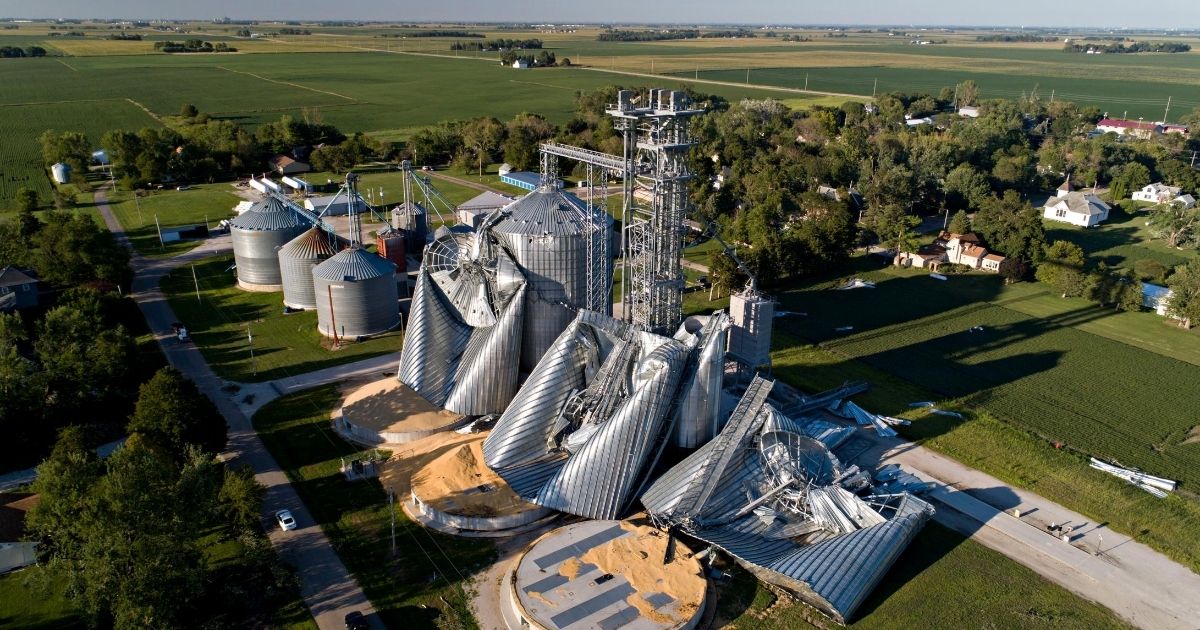 Wind-damaged grain bins are seen at the Heartland Co-Op grain elevator in Luther, Iowa, on Aug. 11, 2020.