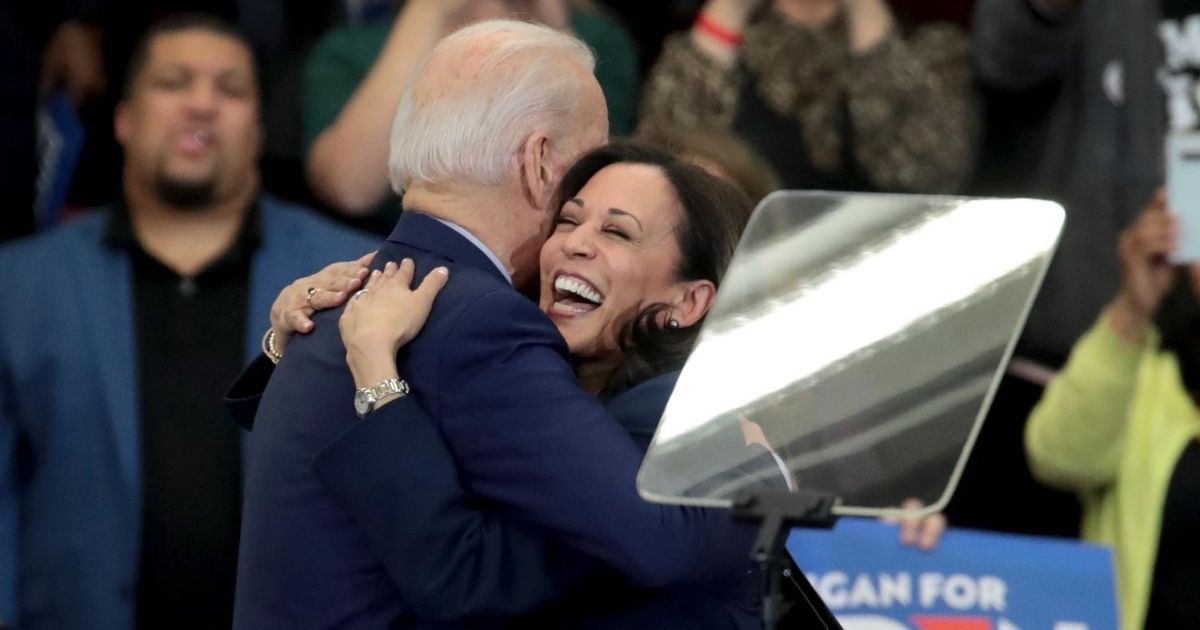 California Democratic Sen. Kamala Harris, right, hugs Democratic presidential candidate former Vice President Joe Biden after introducing him at a campaign rally at Renaissance High School on March 9, 2020, in Detroit.