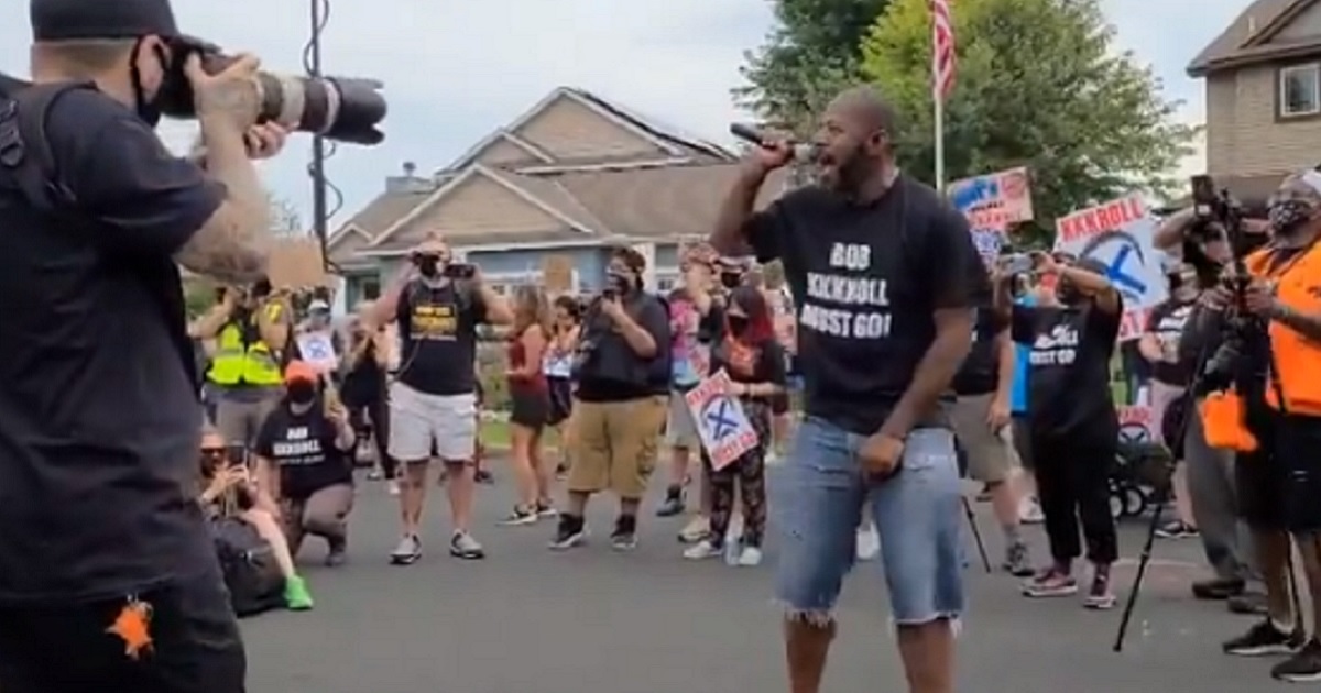 Minnesota state House candidate John Thompson launhes and expletive-filled speech outside the home of a police union president in Hugo, Minnesota.