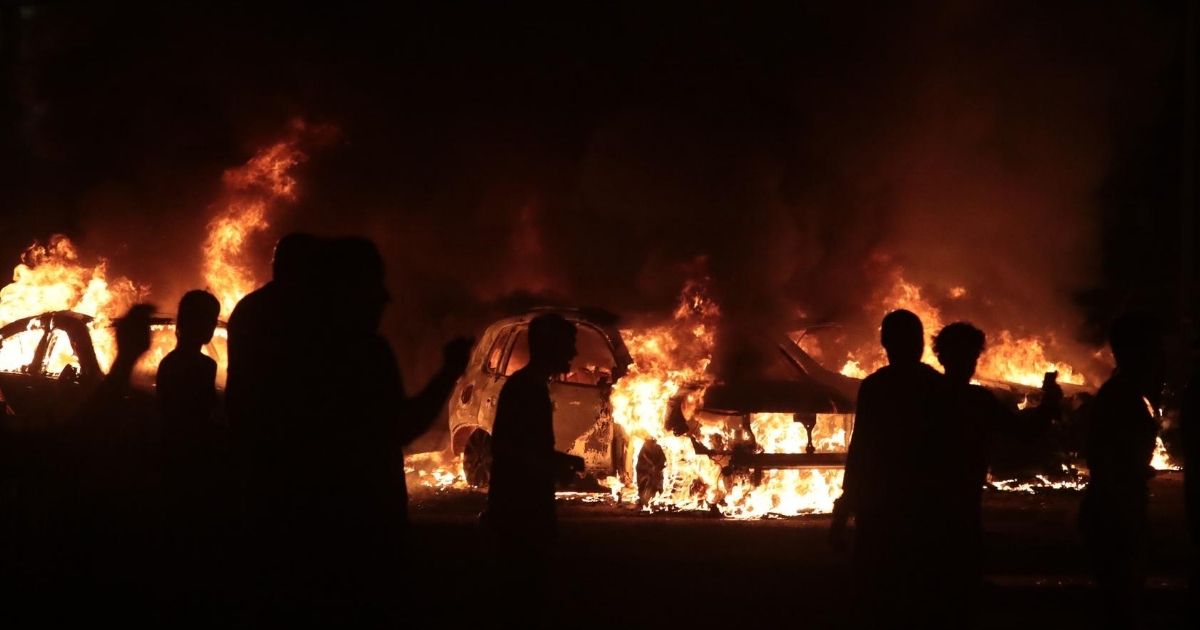 Fires burn during rioting in downtown in Kenosha, Wisconsin, on Aug. 24, 2020.