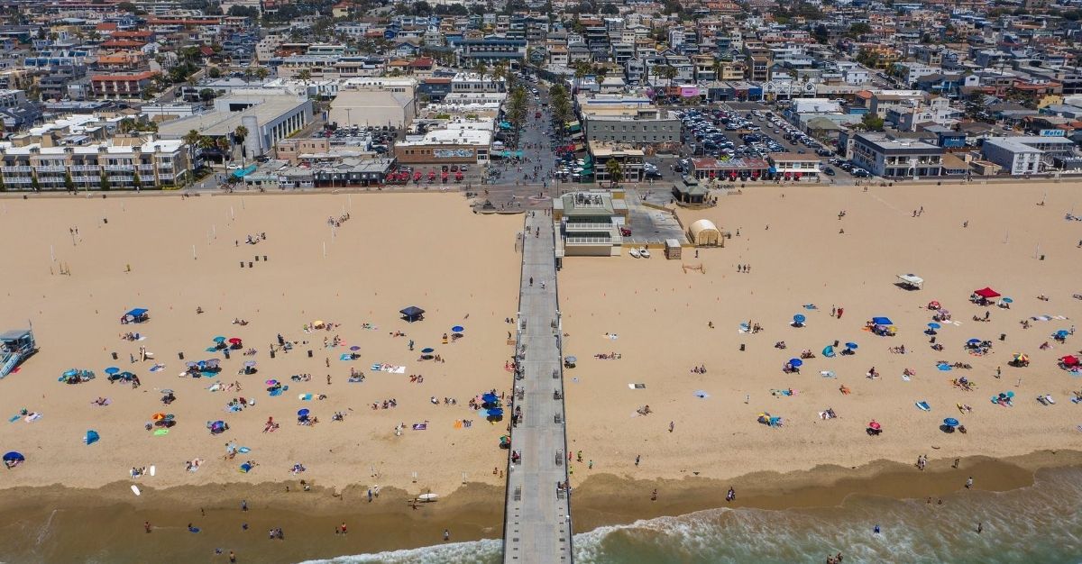 An aerial view shows people on a Los Angeles-area beach during a heatwave on July 12, 2020.