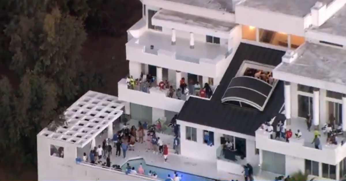 Partygoers are seen at a Beverly Crest mansion.