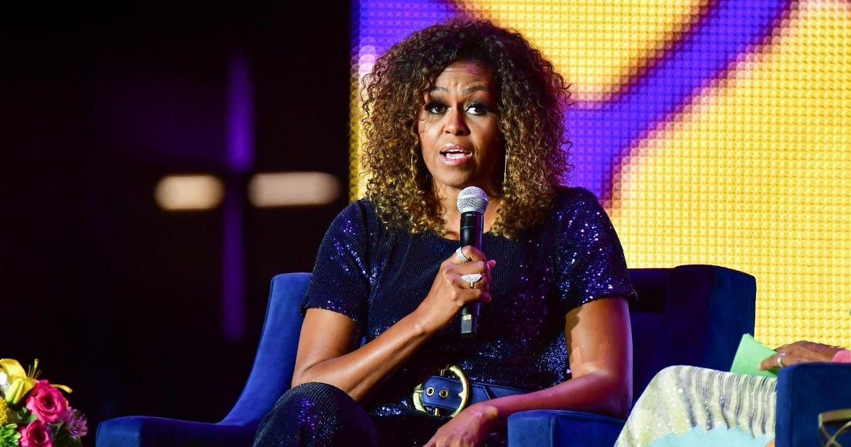A conversation with Michelle Obama takes place during the 2019 ESSENCE Festival at the Mercedes-Benz Superdome on July 6, 2019, in New Orleans, Louisiana.