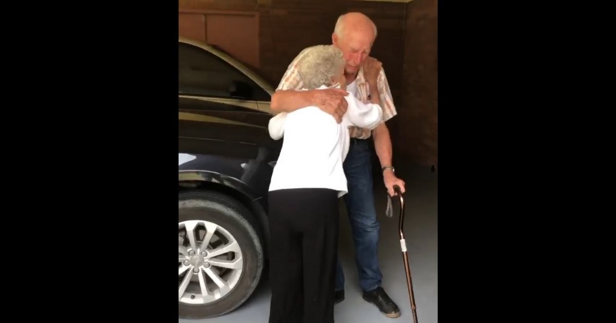Loretta and David Bowen, both 90, embrace after Loretta returned home from the hospital.