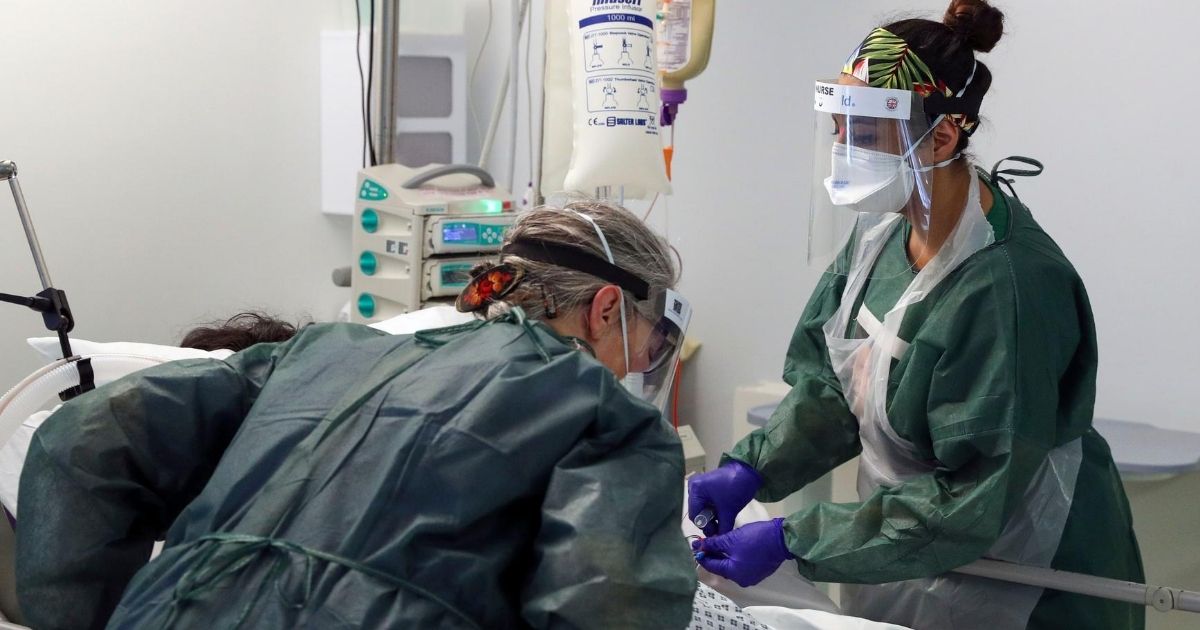 Nurses care for a coronavirus patient at Frimley Park Hospital in the United Kingdom on May 22, 2020.