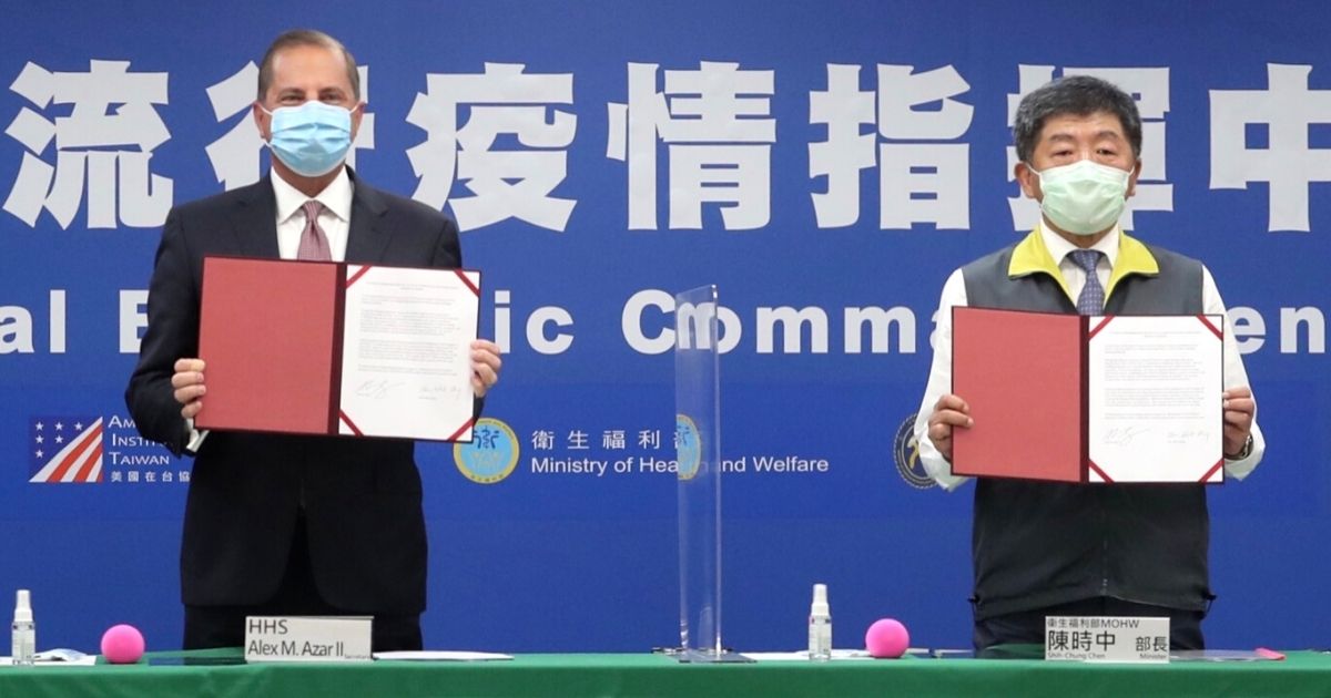 U.S. Health and Human Services Secretary Alex Azar, left, and Taiwan Health Minister Chen Shih-chung display documents of health cooperation during a signing ceremony in Taipei on Aug. 10, 2020.