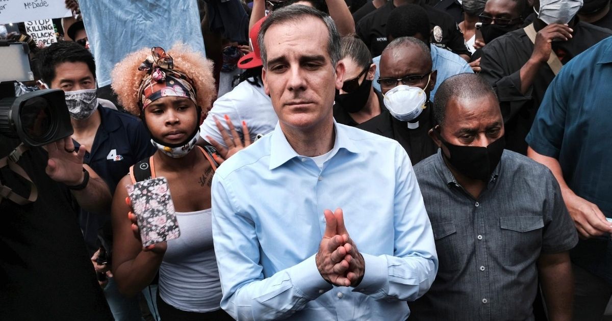 Los Angeles Mayor Eric Garcetti talks to Black Lives Matter protesters in downtown Los Angeles on June 2, 2020.