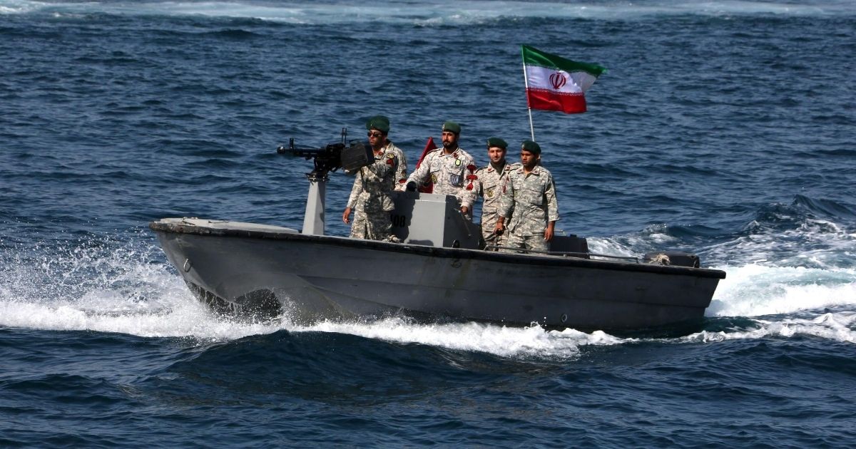 Iranian soldiers aboard a gun boat take part in a "National Persian Gulf Day" ceremony in the Strait of Hormuz in an April 2019 file photo.
