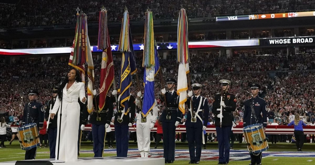 Singer Demi Lovato sings the national anthem during Super Bowl LIV between the Kansas City Chiefs and the San Francisco 49ers at Hard Rock Stadium in Miami Gardens, Florida, on Feb. 2, 2020.