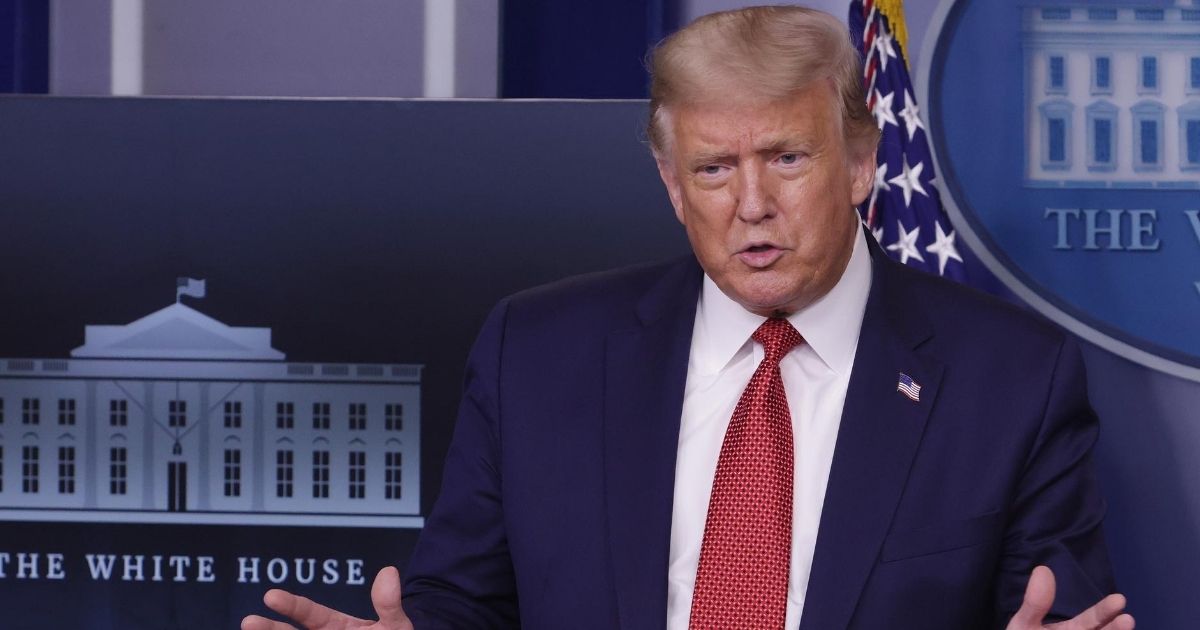 President Donald Trump addresses reporters Monday during a White House news briefing.