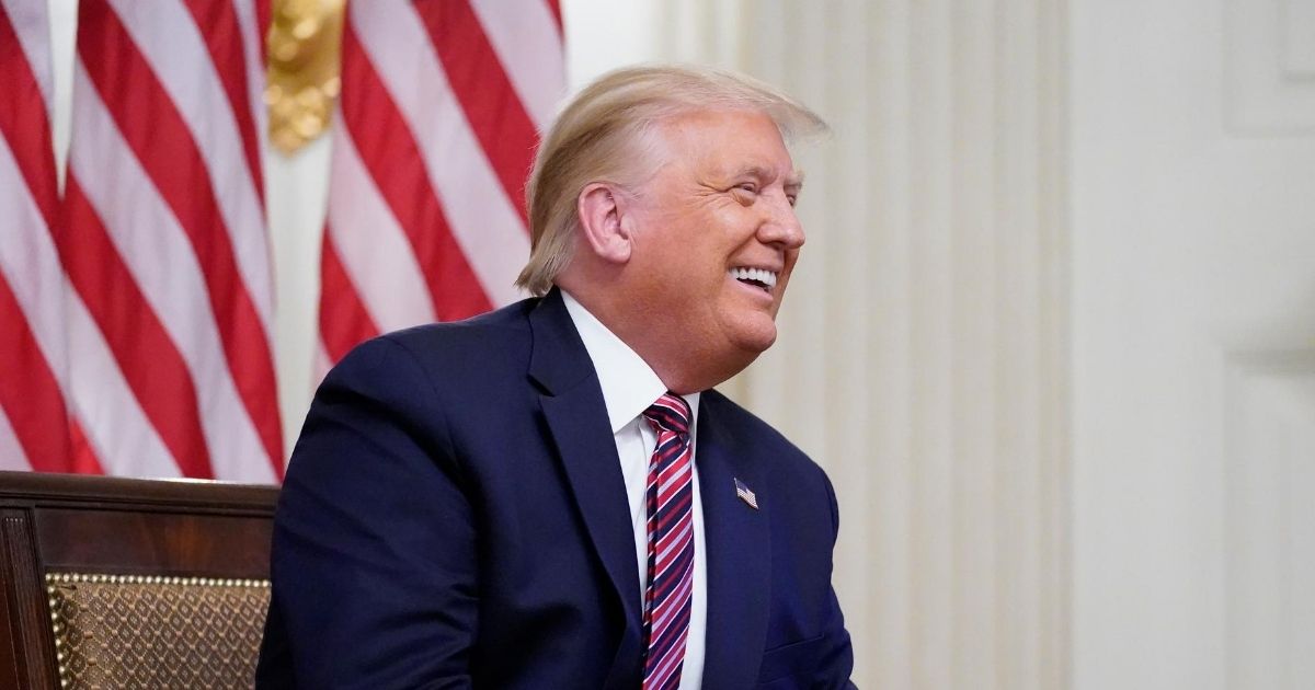 President Donald Trump smiles during an event called "Kids First: Getting America's Children Safely Back to School" in the White House on Aug. 12, 2020, in Washington, D.C.