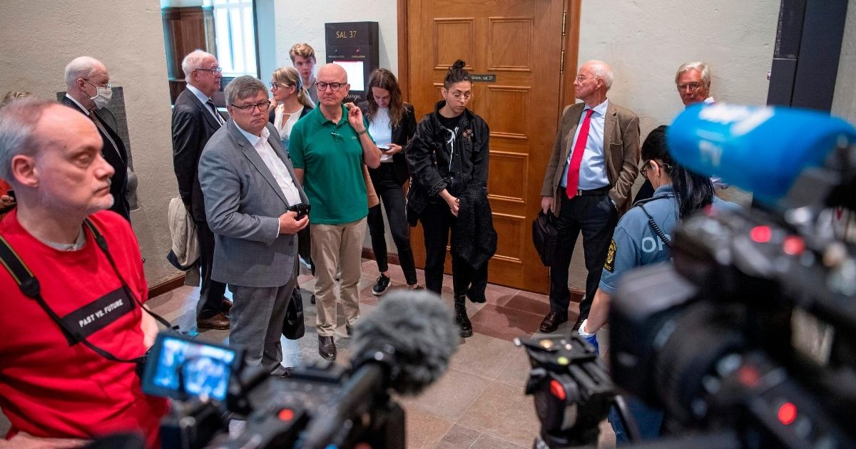 Journalists wait for the start of a district court trial in Stockholm, Sweden, on June 5, 2020. At the next level, Swedish appeals courts have overruled the deportation orders of migrant criminals.