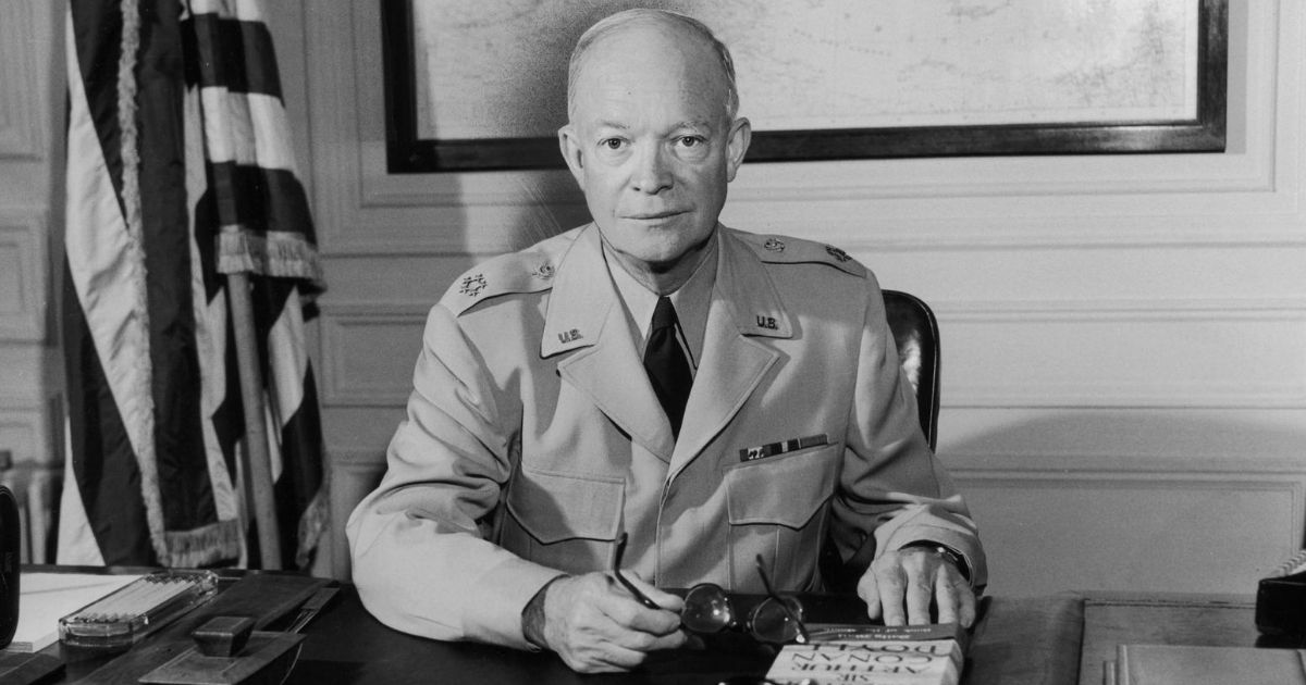 Former President Dwight D. Eisenhower, then the supreme Allied commander, sits at his desk at headquarters.