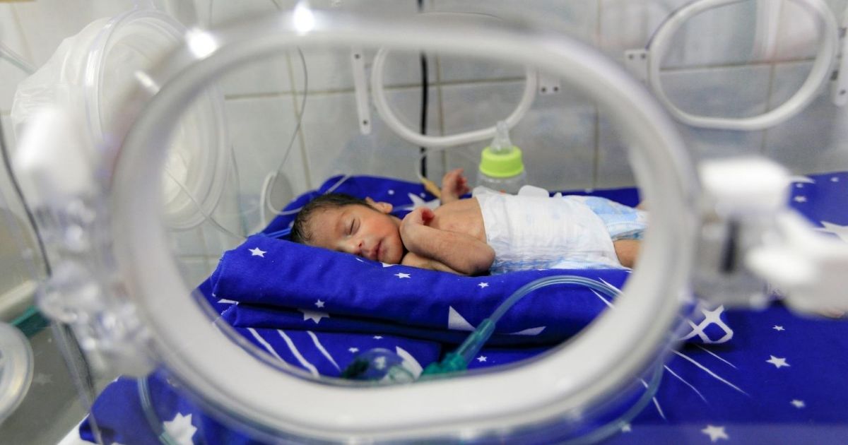 A prematurely born infant lies inside an incubator at the neonatal intensive care unit at a Yemen hospital on June 30, 2020.
