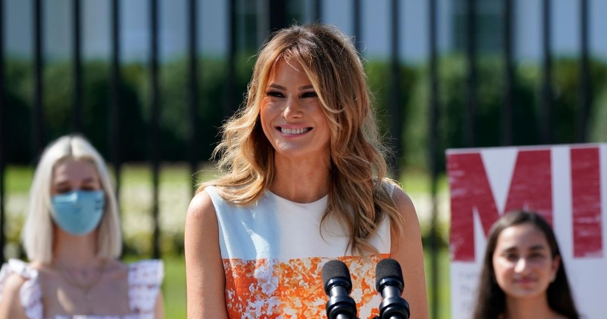 First lady Melania Trump visits an exhibit of artwork by young Americans in celebration of the 100th anniversary of the 19th Amendment, which afforded the vote to women, at the White House in Washington, D.C., on Aug. 24, 2020.