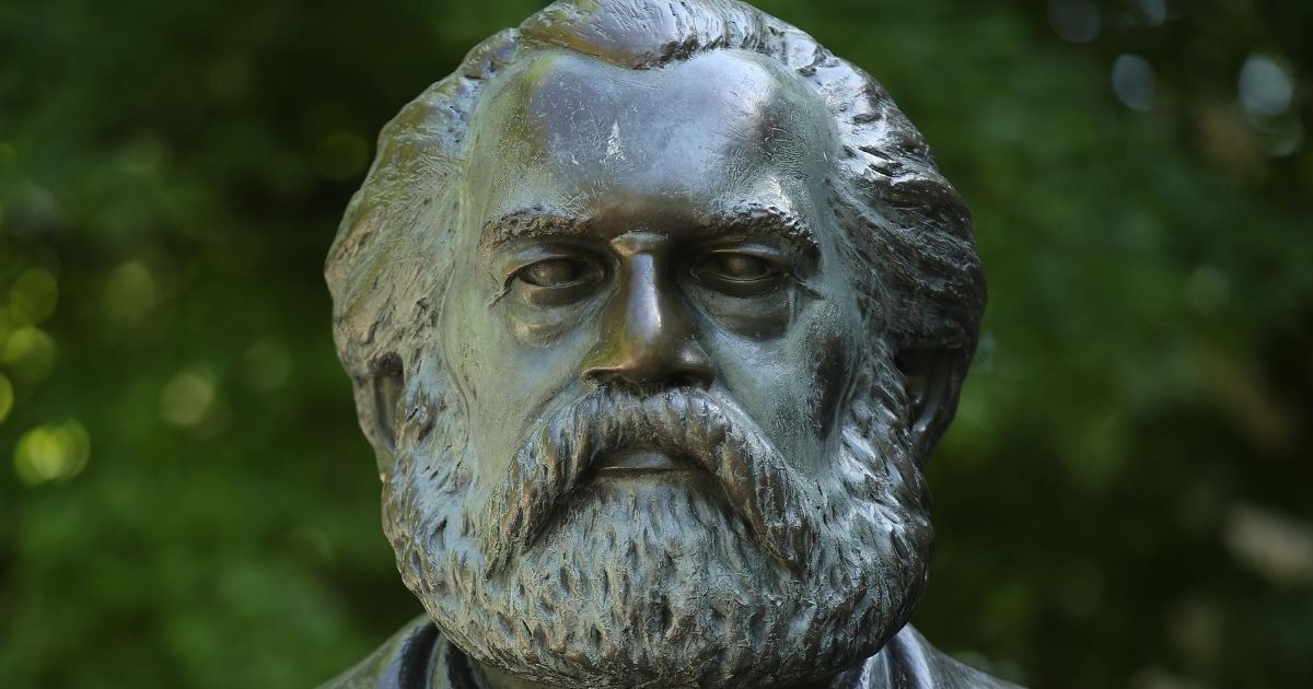 A statue of philosopher and revolutionary Karl Marx stands in a public park on May 4, 2018, in Berlin.