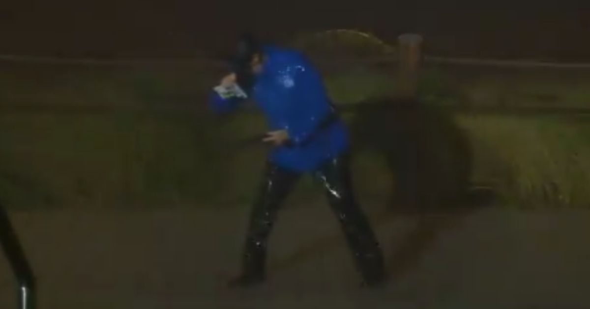 A reporter struggles against 72 mph winds as she covers Hurricane Laura's landfall in Lake Charles, Louisiana.