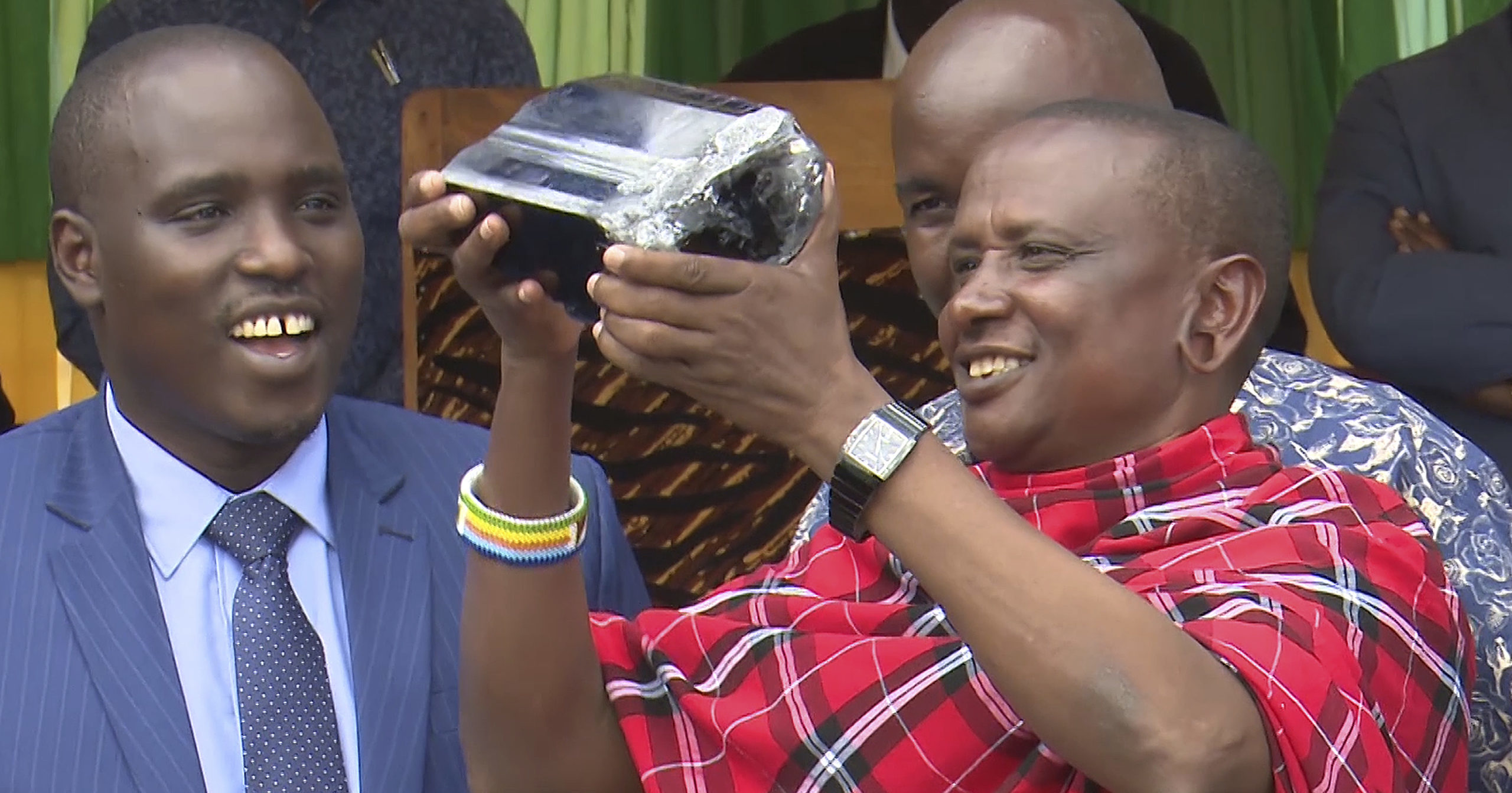 In this image taken from video, Saninu Laizer, a small scale miner, holds a 13-pound tanzanite stone he dug up in Mererani, Tanzania, on Aug. 3, 2020. The stone has an estimated value of $2 million.