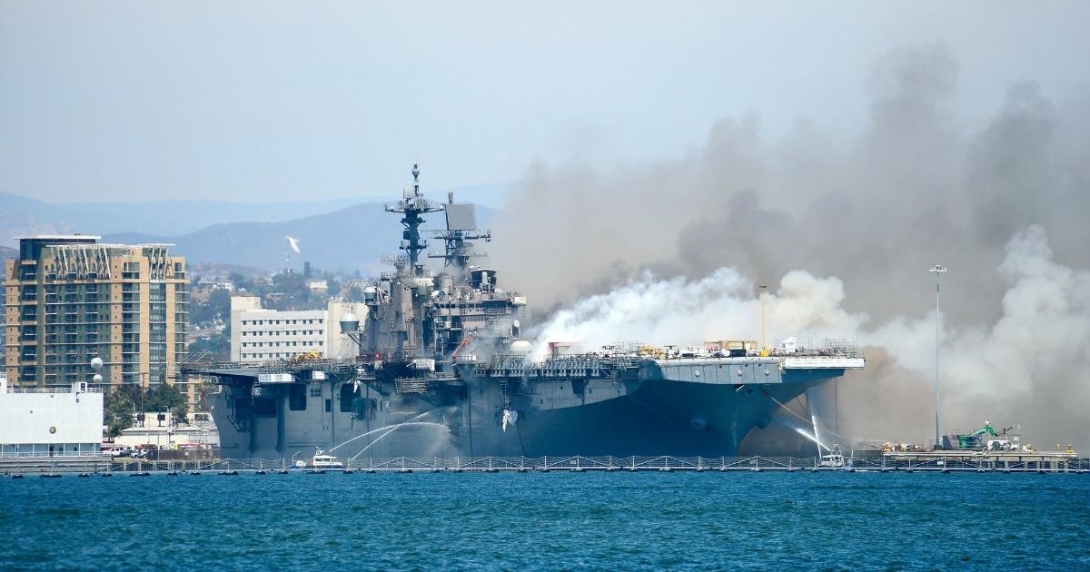 Port of San Diego Harbor Police Department boats combat a fire aboard the amphibious assault ship USS Bonhomme Richard at Naval Base San Diego on July 12, 2020.