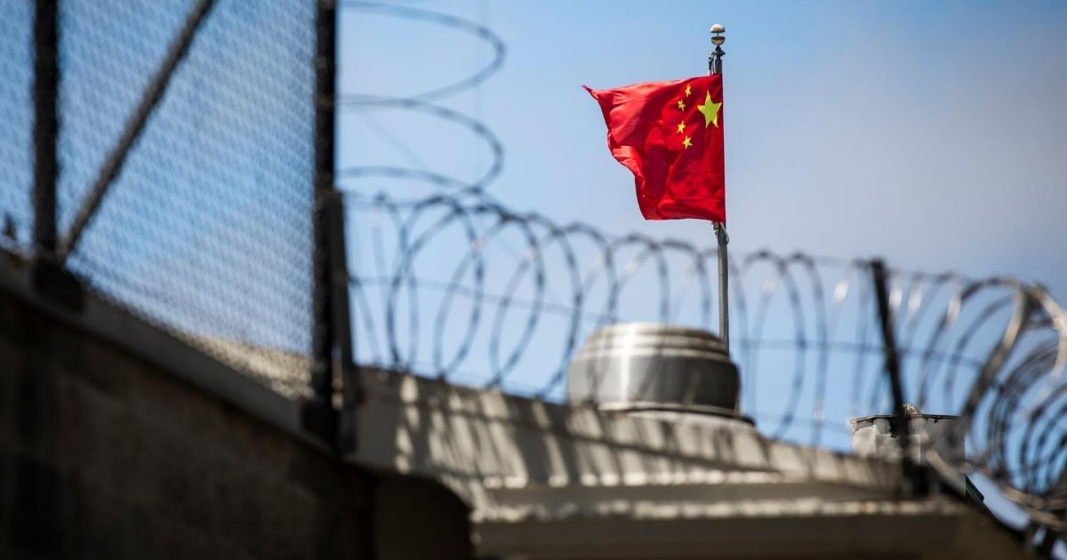 The Chinese flag flies behind barbed wire at the Chinese consulate in San Francisco, California, on July 23, 2020.