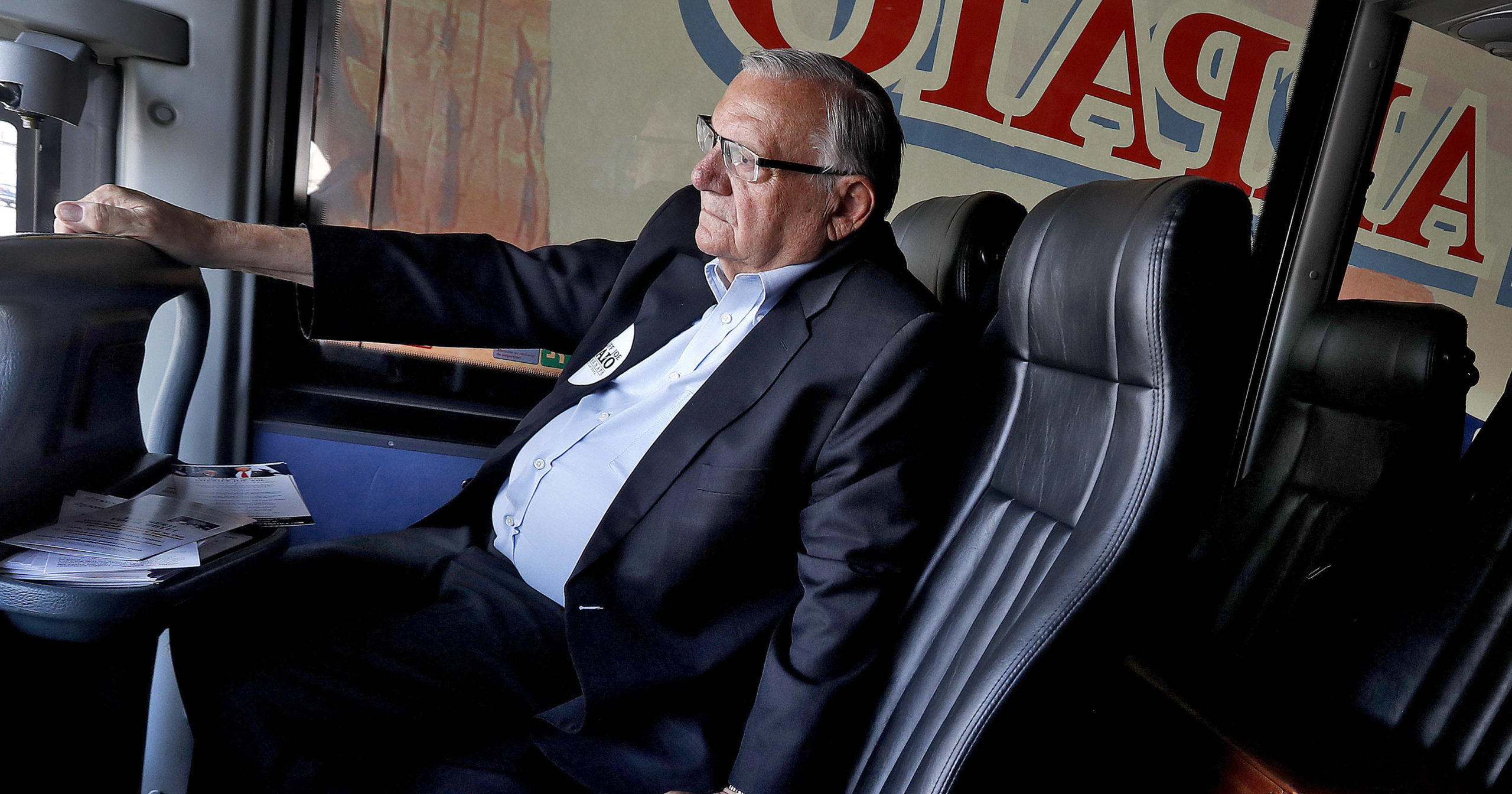 In this Aug. 23, 2018, file photo, U.S. Senate candidate and former Maricopa County Sheriff Joe Arpaio rides on his campaign bus in Phoenix. Arpaio's primary defeat in his bid to win back the sheriff's post in metro Phoenix marks the end of what's likely to be the 88-year-old lawman’s last political campaign.