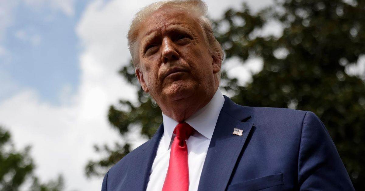 President Donald Trump talks to reporters as he departs the White House for a trip to Ohio on Aug. 6, 2020, in Washington, D.C.