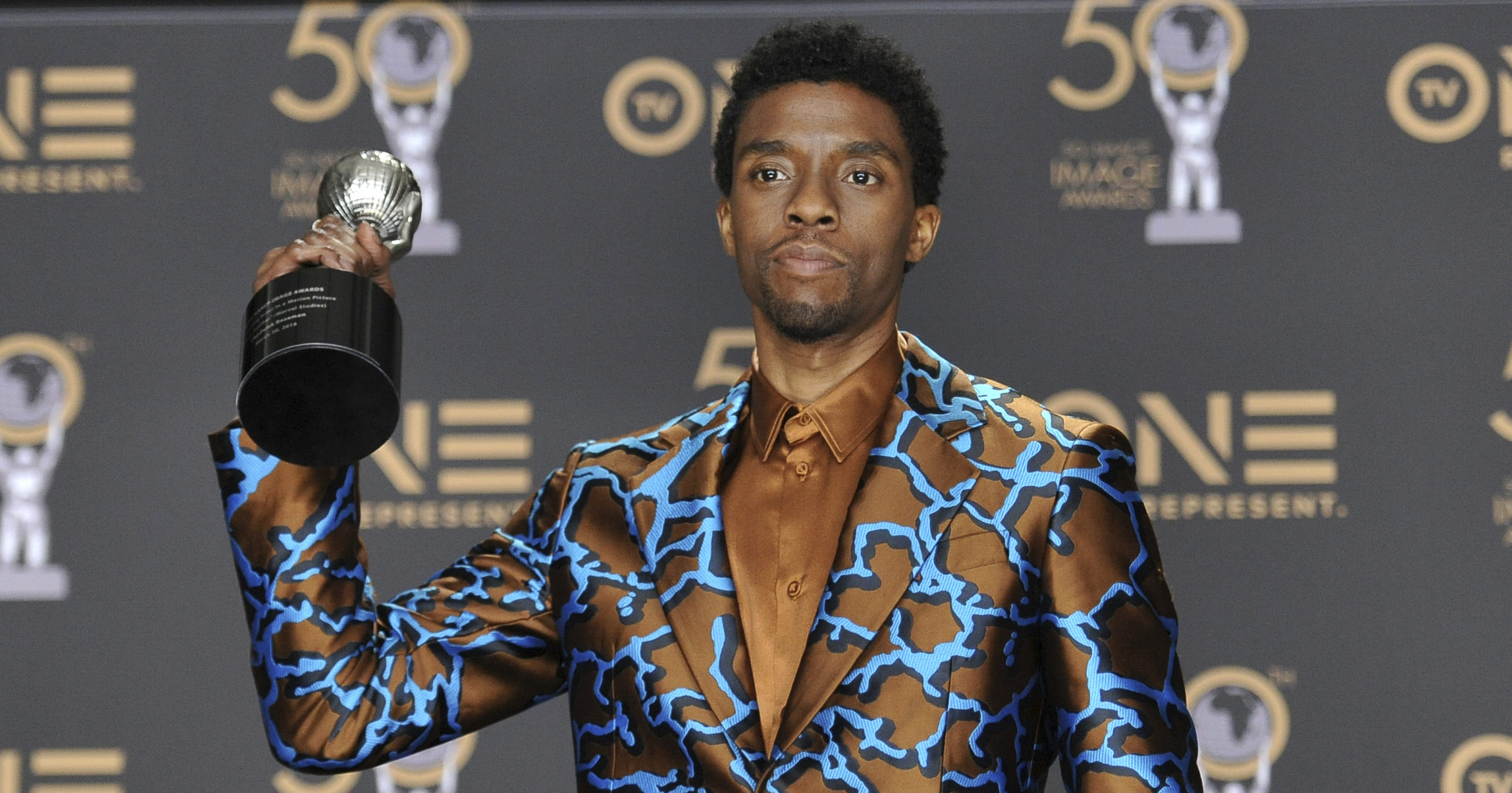 In this March 30, 2019, file photo, Chadwick Boseman poses in the media room with the award for outstanding actor in a motion picture for "Black Panther" at the 50th annual NAACP Image Awards at the Dolby Theatre in Los Angeles.