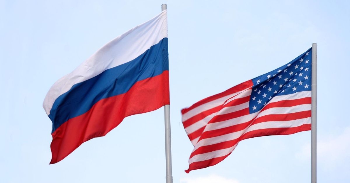 The Russian flag waves alongside the American in this stock image.