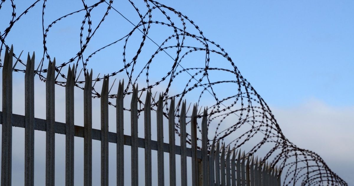 A fence is seen in the above stock image.